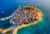 primosten-town-croatia-view-city-from-air-seascape-with-beach-old-town-view-from-drone-peninsula-with-houses-travel-vacation-image