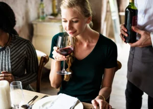 woman-tasting-red-wine-classy-restaurant