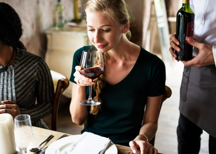 woman-tasting-red-wine-classy-restaurant